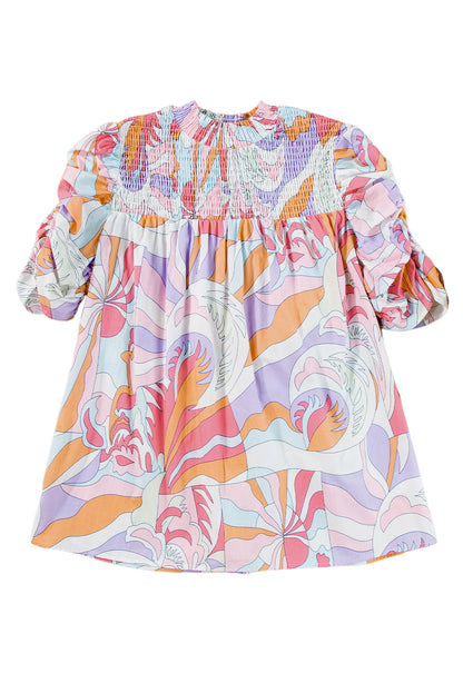 Roze blouse met abstracte print en bubbelmouwen en kieldetail