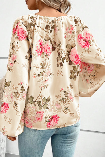 Beige blouse met V-hals met bloemenprint en lantaarnmouwen