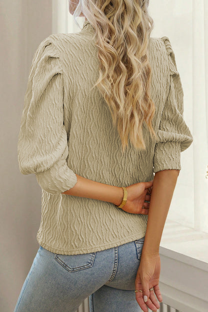 Abrikoos vintage getextureerde top met pofmouwen en nephals
