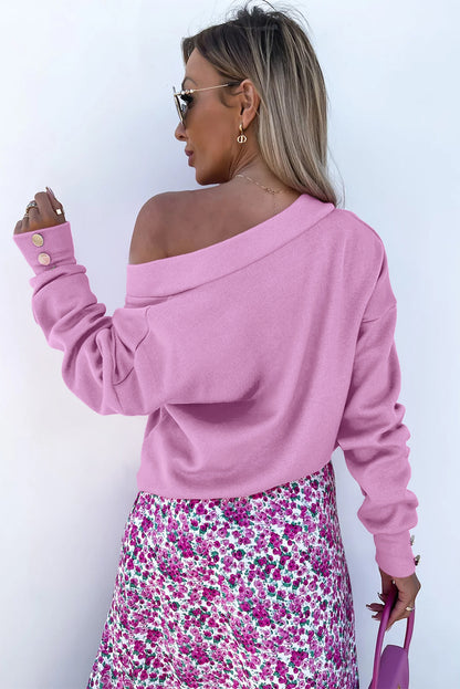 Paarse gebreide blouse met V-hals en knoopmanchetten
