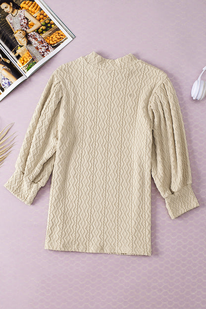 Abrikoos vintage getextureerde top met pofmouwen en nephals