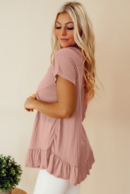 Roze effen top met korte mouwen en ruches aan de zoom