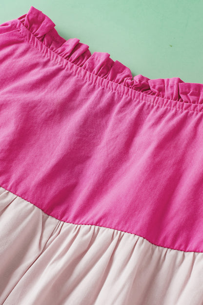 Roze colorblock blouse met ruches aan de mouwen en V-hals