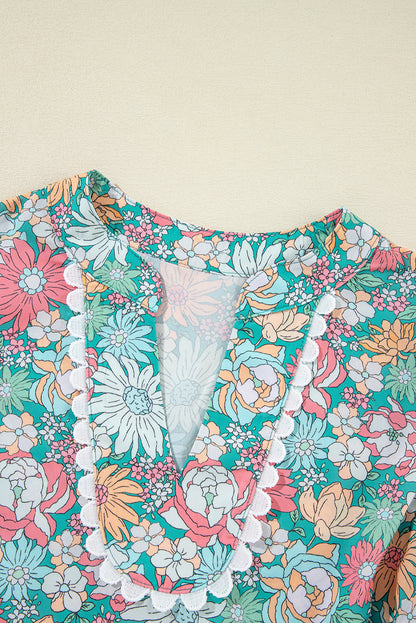 Veelkleurige bloemenblouse met ingekeepte hals en korte mouwen