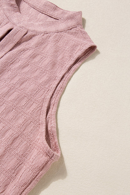 Roze tanktop met splithals en traliestructuur