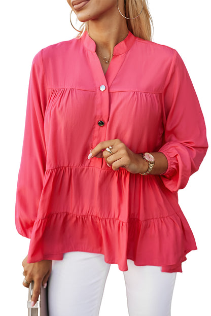 Roze blouse met halfgeknoopte ruches en gelaagde lange mouwen