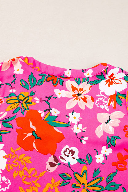 Blouse met rozenbloemen en split-V-hals en pofmouwen