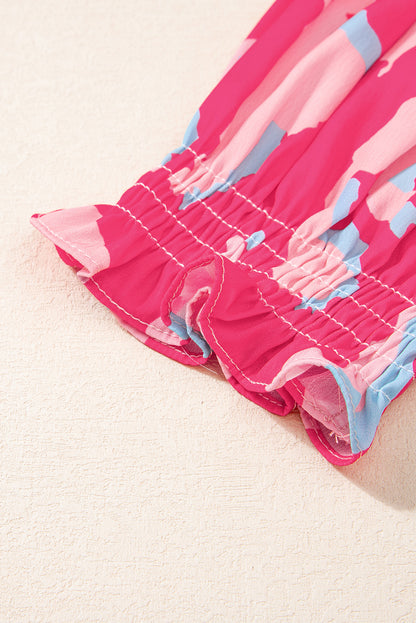 Gesmokte blouse met V-hals en pofmouwen met rozen-abstracte print