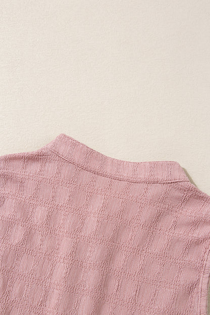 Roze tanktop met splithals en traliestructuur