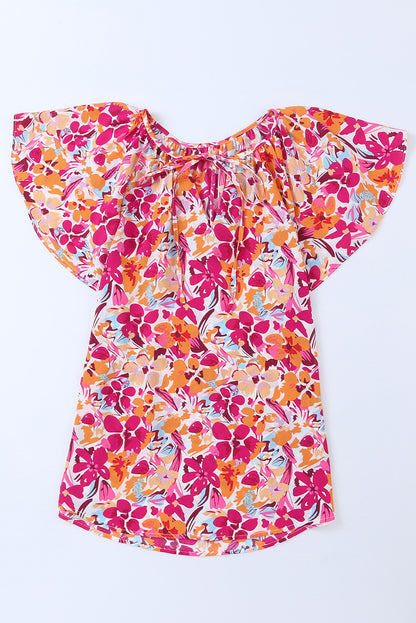 Vurige rode top met bloemenprint en fladdermouwen