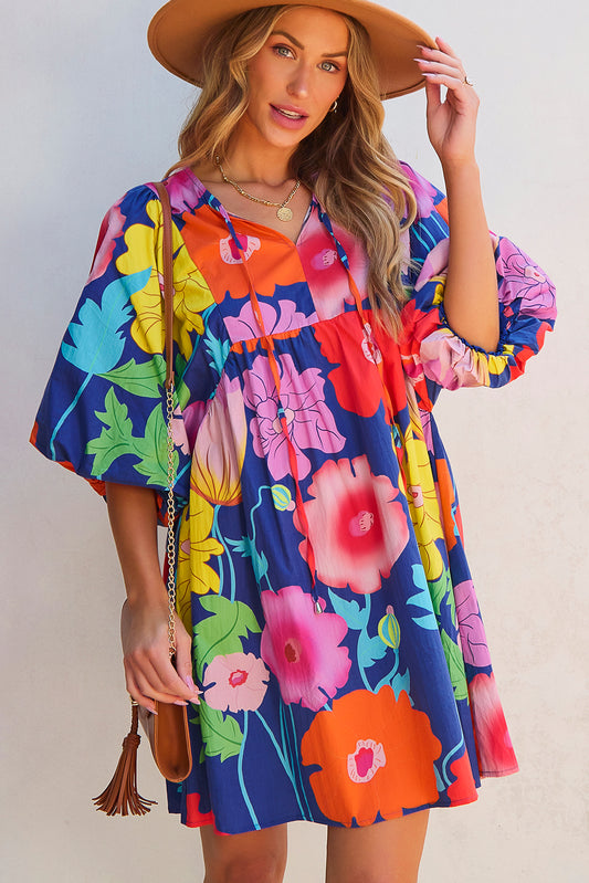 Donkerblauwe bloemenprint split nek babydoll jurk