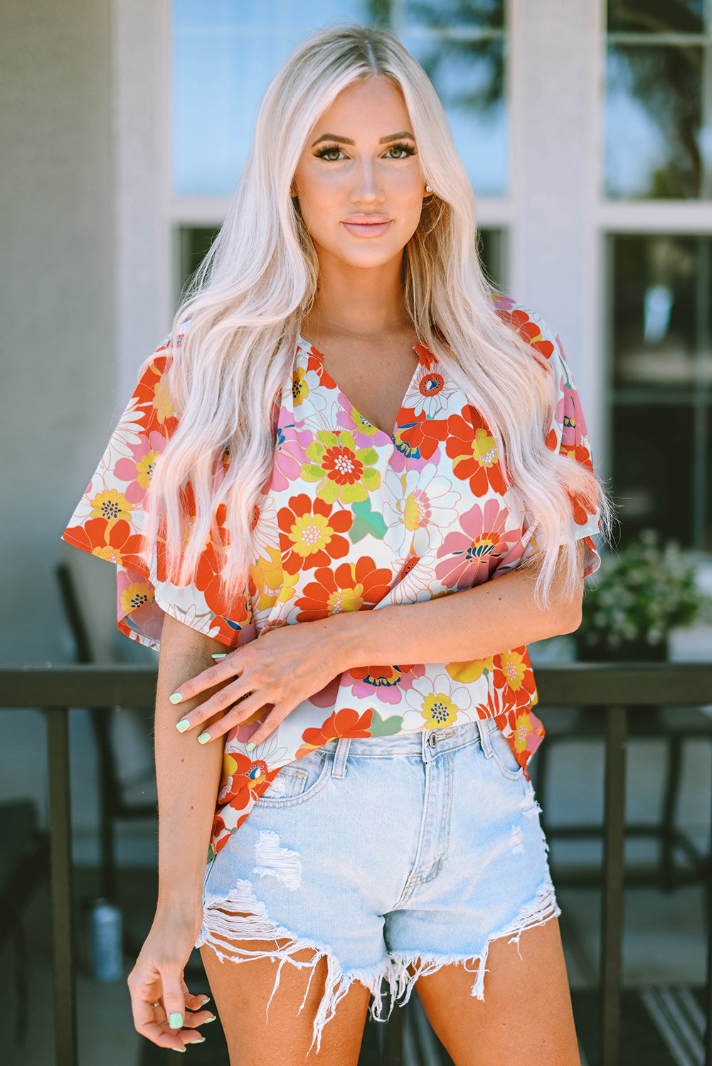 Oranje blouse met abstracte print en V-hals en halve mouw