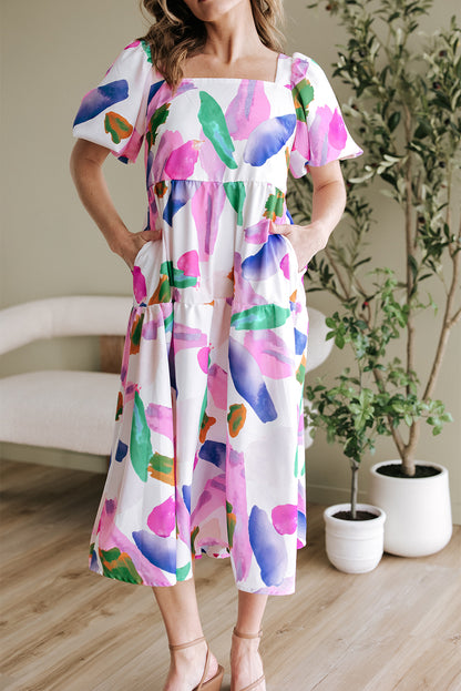 Paarse midi-jurk met gesmokte achterkant en pofmouwen met abstracte print