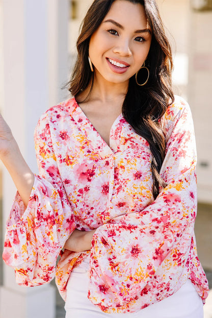 Roze, met bloemen bedrukte blouse met V-hals en bubbelmouwen