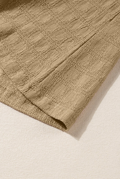 Licht Frans beige tanktop met splithals en roosterstructuur