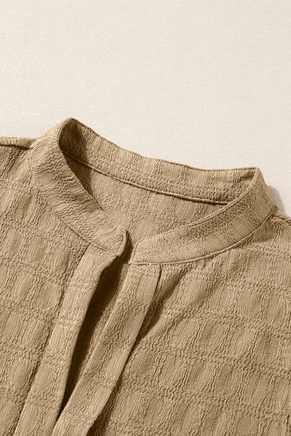 Licht Frans beige tanktop met splithals en roosterstructuur