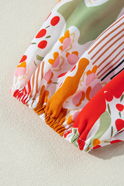 Oranje bedrukte blouse met V-hals en pofmouwen