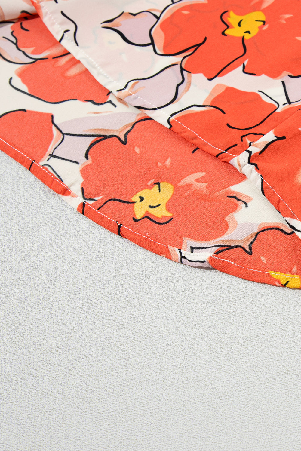 Oranje bloemen losse blouse met bubbelmouwen en ruches aan de hals