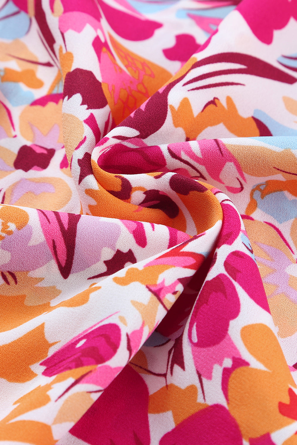 Vurige rode top met bloemenprint en fladdermouwen