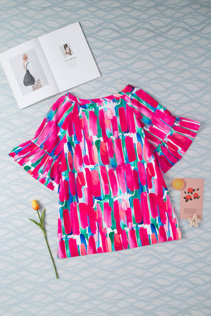 Blouse met V-hals en knoopsluiting met roze abstracte penseelvoering