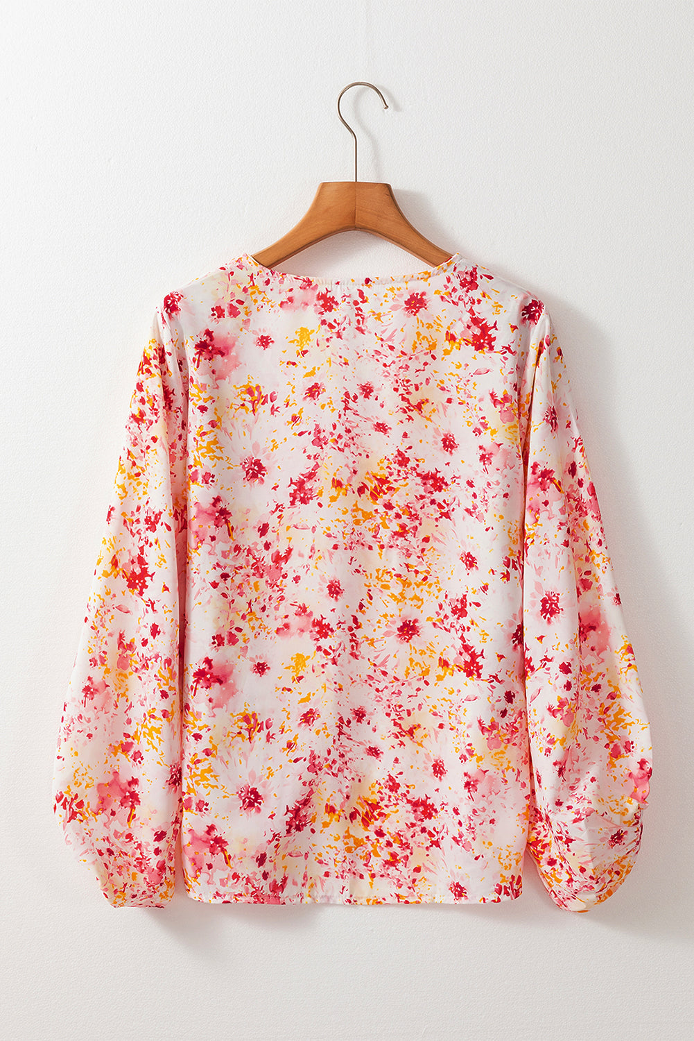 Roze, met bloemen bedrukte blouse met V-hals en bubbelmouwen