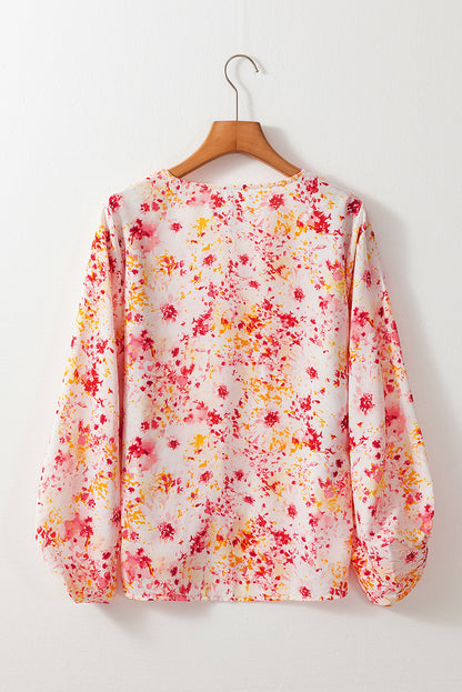 Roze, met bloemen bedrukte blouse met V-hals en bubbelmouwen