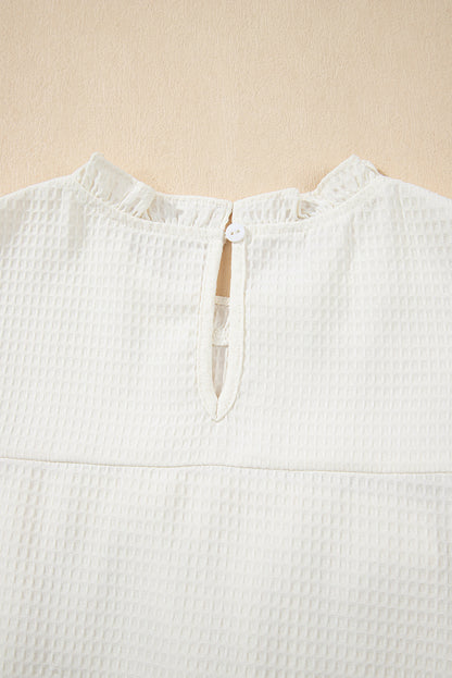 Witte vaste kleur ruches trim wafel gebreide blouse