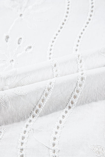 Witte tanktop met geknoopte bandjes en V-hals met borduurmotief