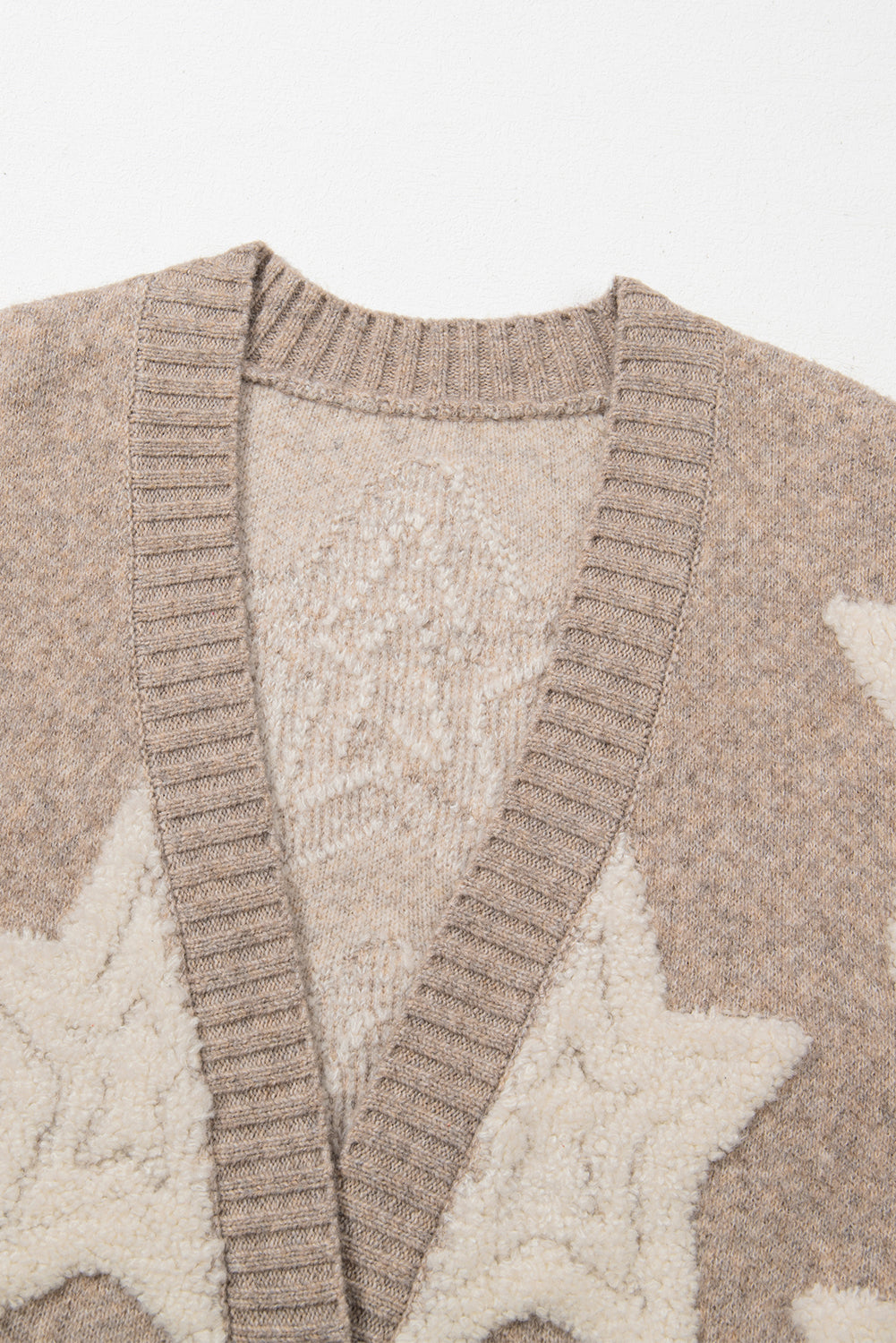 Kaki vest met sherpa-sweater met sterrenpatroon en zakken