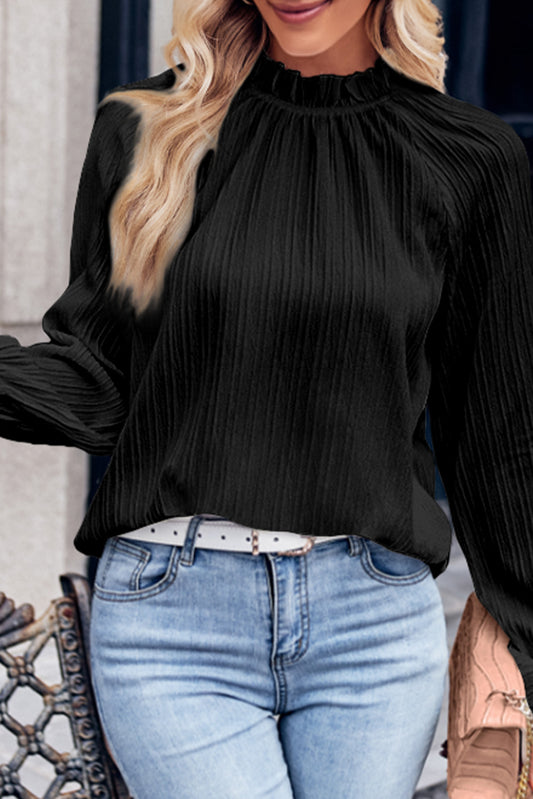 Zwarte blouse met ruches en rimpelige bubbelmouw