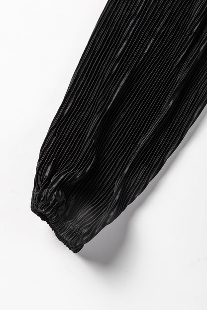 Zwarte cropped trui met koord en broek met wijde pijpen