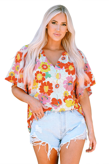 Oranje blouse met abstracte print en V-hals en halve mouw