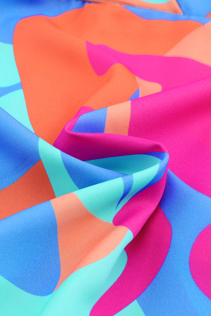 Jurk met veelkleurige abstracte print en V-hals en pofmouwen