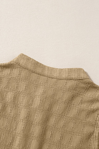 Licht Frans beige tanktop met splithals en roosterstructuur