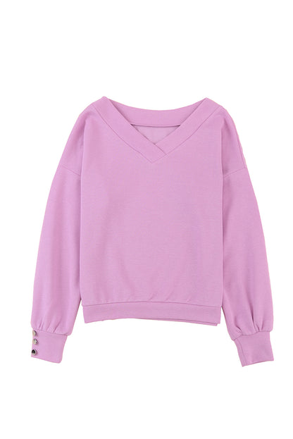 Paarse gebreide blouse met V-hals en knoopmanchetten