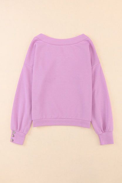 Paarse gebreide blouse met V-hals en knoopmanchetten
