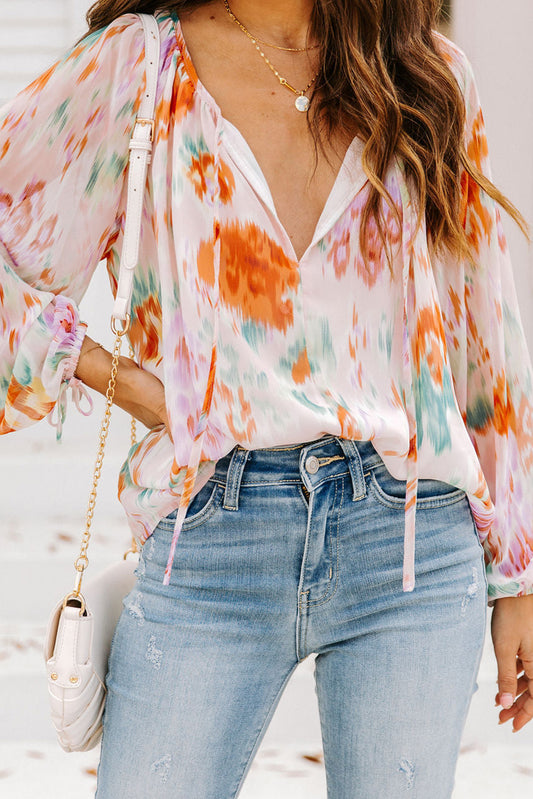 Blouse met veelkleurige abstracte print en splithals en pofmouwen