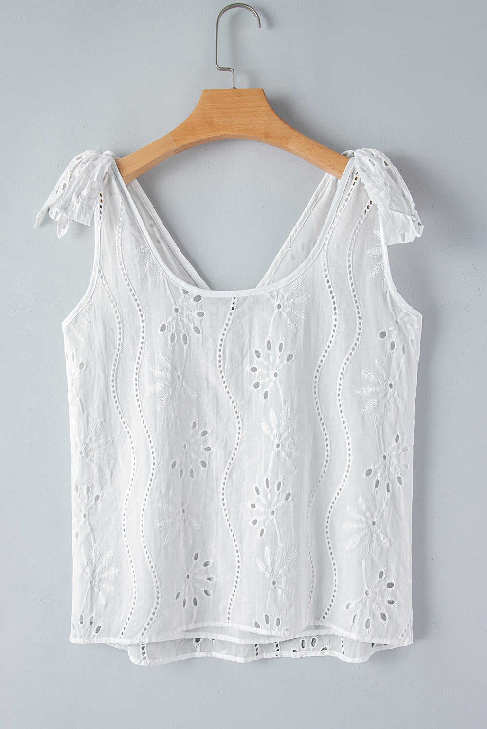 Witte tanktop met geknoopte bandjes en V-hals met borduurmotief