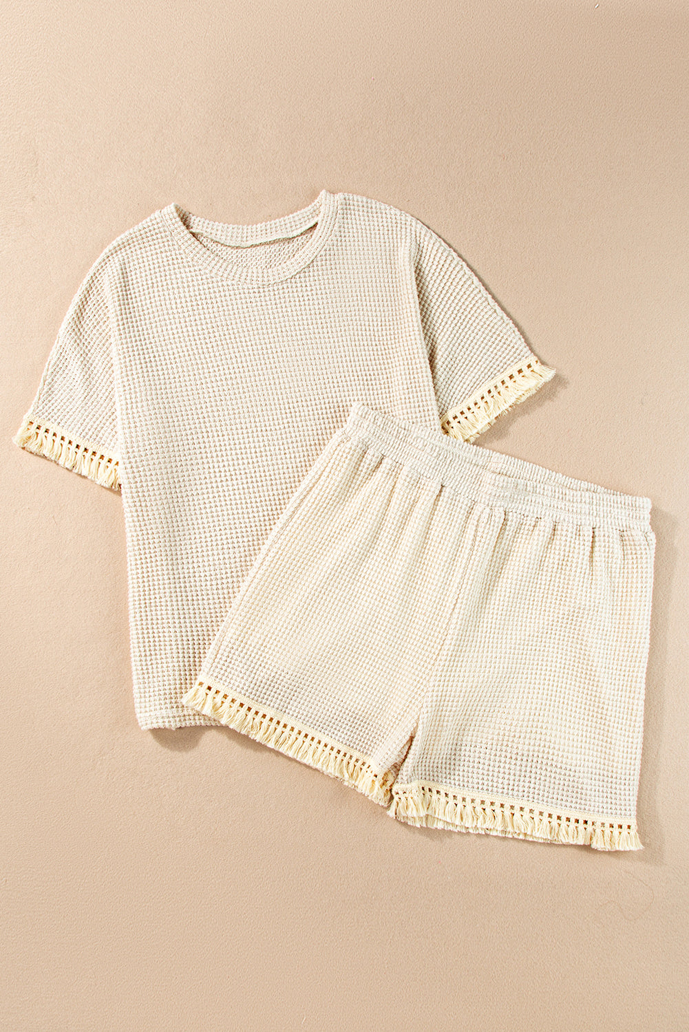 Beige korte tweedelige set met franjes en getextureerde rand
