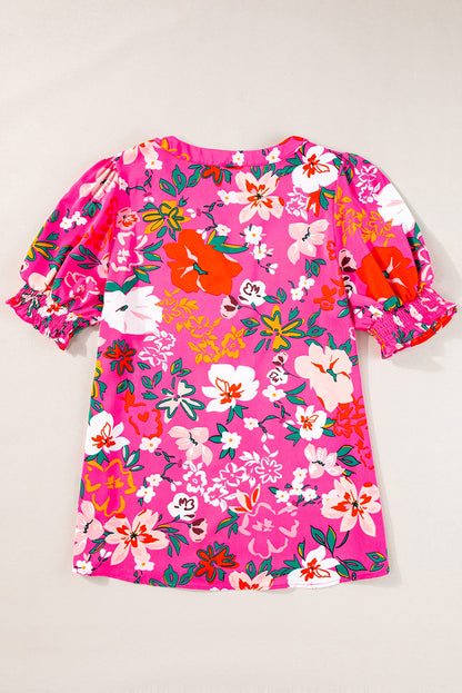Blouse met rozenbloemen en split-V-hals en pofmouwen