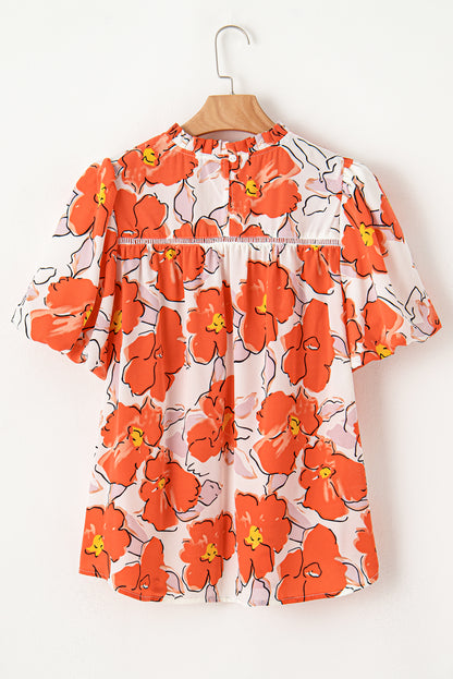 Oranje bloemen losse blouse met bubbelmouwen en ruches aan de hals