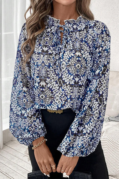 Blauwe tribale afdruk vaarten met fronvilde nek puff mouw blouse