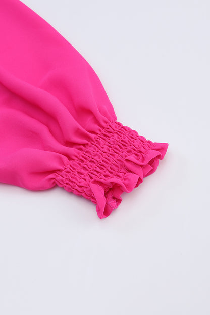 Roze geplooide blouse met V-hals en gezwollen mouwen
