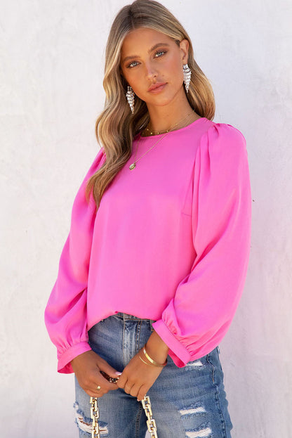 Roze satijnen blouse met ronde hals en lange mouwen