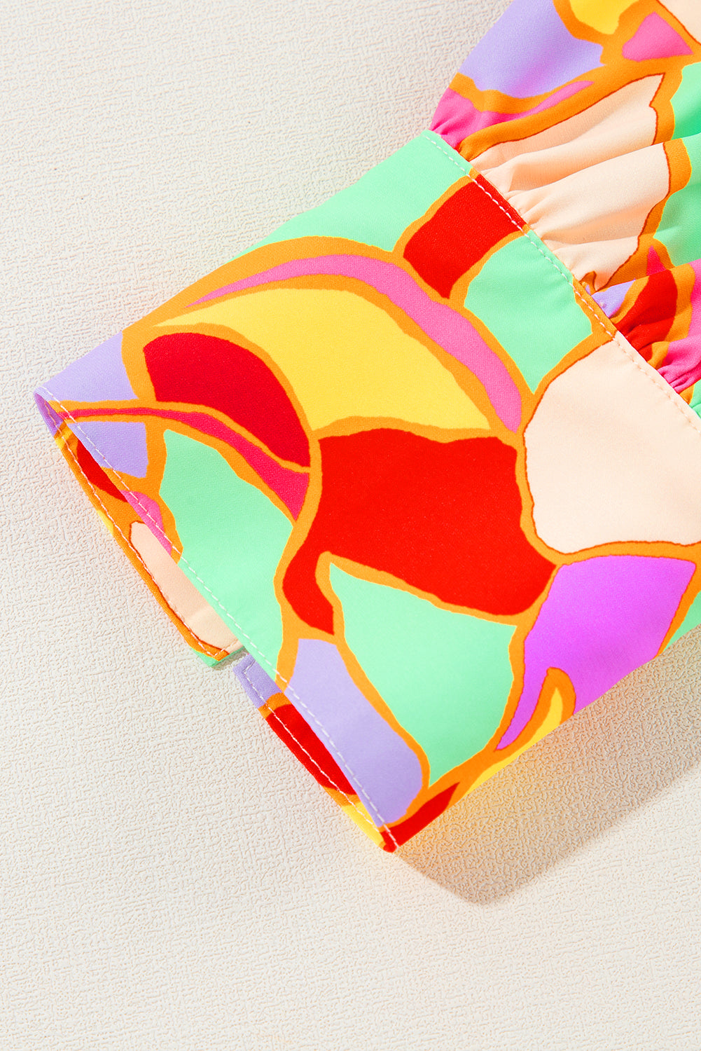 Gele blouse met abstracte print en pofmouwen
