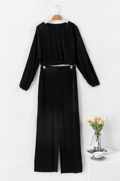 Zwarte cropped trui met koord en broek met wijde pijpen