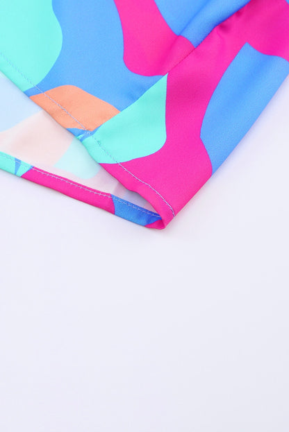 Jurk met veelkleurige abstracte print en V-hals en pofmouwen