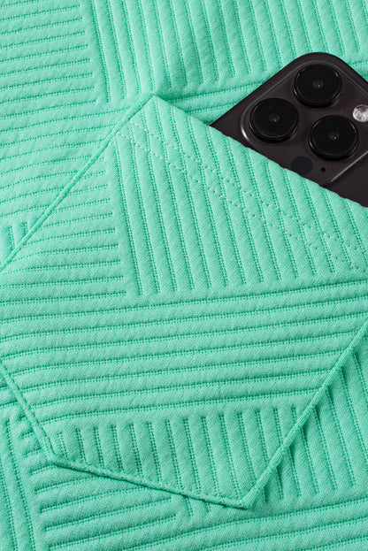 Mintgroene T-shirtjurk met getextureerde kapmouw